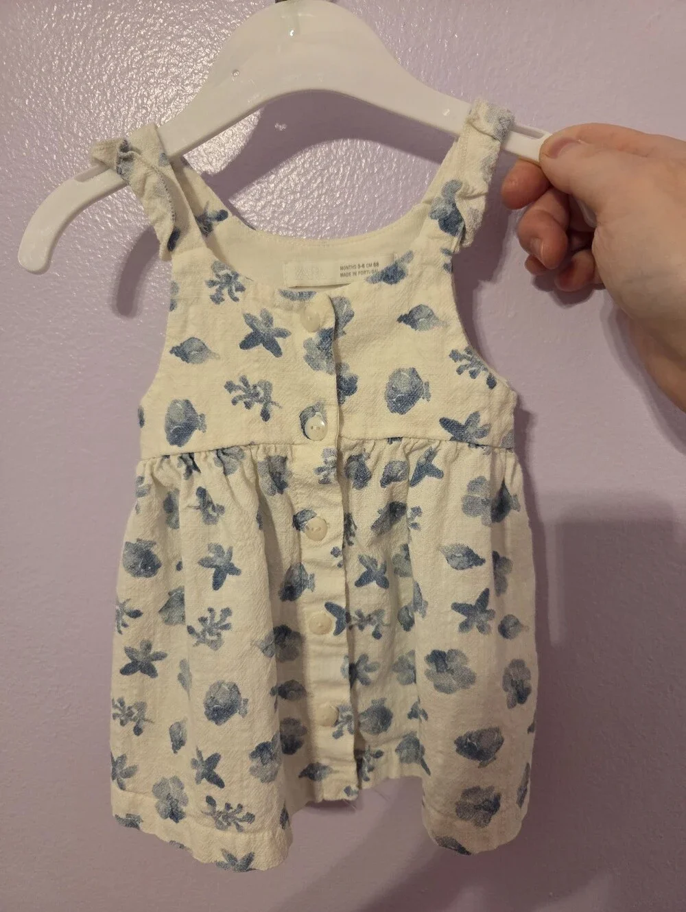 Zara baby girl's white linen dress with a blue marine print